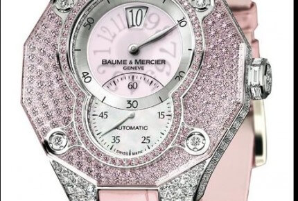 The Baume & Mercier Riviera High Jumping Hour combines fashion sensibility with gemsetting. The Dubois Depraz jumping hour movement indicates hours in a window at 12 o’clock. The 18k gold case is set with 400 diamonds of 9.5 carats total. A pink sapphire crystal is fixed over the dial and bezel.