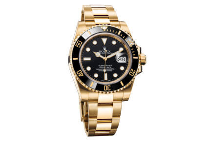 Rolex Oyster Submariner Date in 18k yellow gold with black bezel and dial