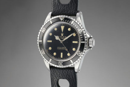 Rolex Submariner Reference 5513, launched circa 1962, was among the first to be fitted with a crown guard. The glossy black dial has gilt printing matching the patina on the indexes and hands. It sold at Phillips Auction 6 for CHF 22,500