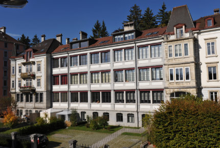 A typical building in La Chaux-de-Fonds, with large windows on each floor so that natural light can enter.