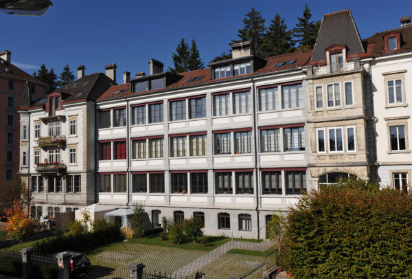A typical building in La Chaux-de-Fonds, with large windows on each floor so that natural light can enter.