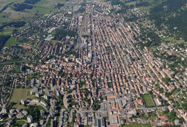 La Chaux-de-Fonds with Le Locle in the distance. This aerial view clearly shows the town's grid of streets.