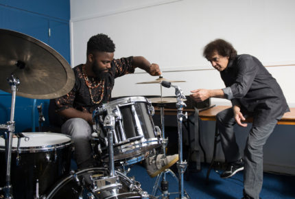 Marcus Gilmore demonstrates his work to his mentor Zakir Hussain
